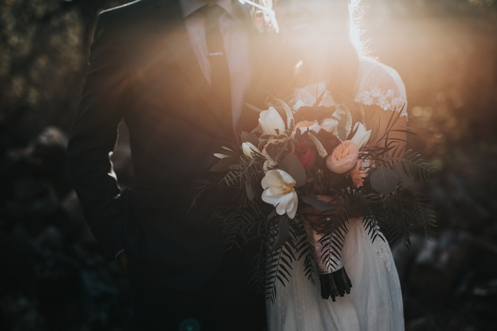 An intimate wedding moment in warm sunlight